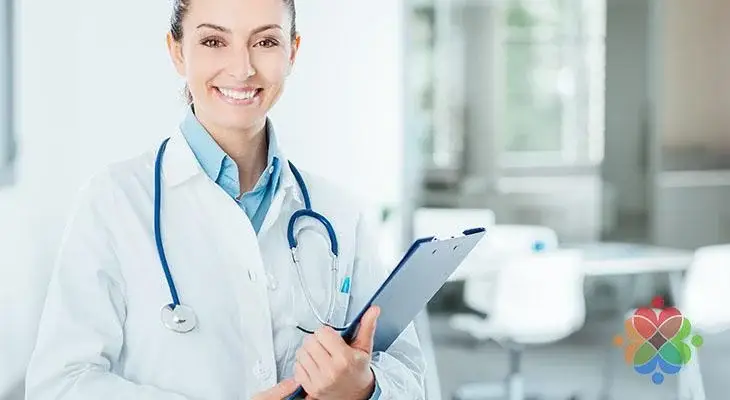 Smiling female doctor holding a clipboard, representing lifestyle management for hypertension