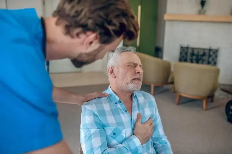 Chest discomfort cardiologist evaluating a patient for angina, shortness of breath, and heart disease warning signs